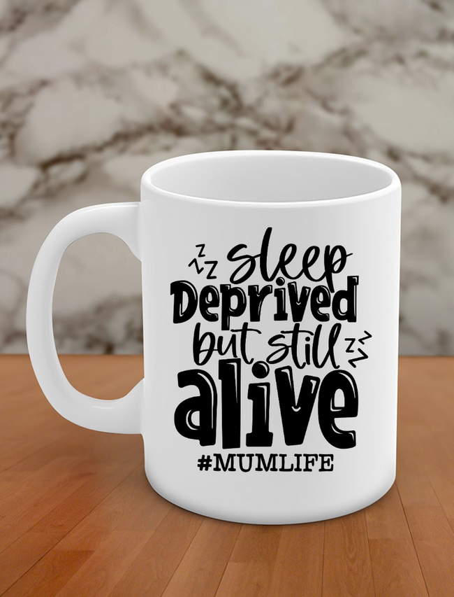 Sleep deprived but still alive #mum life Hover Image