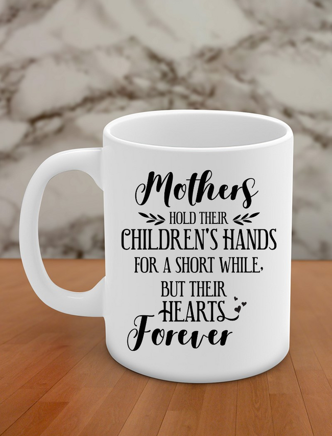 mothers hold their children's hands for a short while but their hearts forever Hover Image